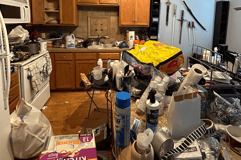 cluttered kitchen with boxes