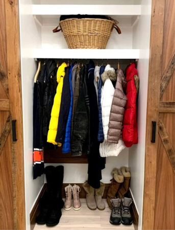 coat closet with sliding barn doors