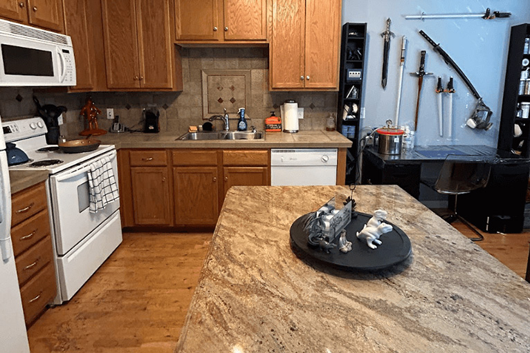 organized kitchen with large granite island